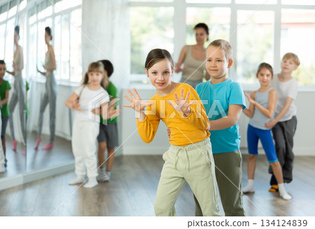 Positive juvenile boy and girl engaged in Rock 'n' Roll dance during dancing classes Positive juvenile boy and girl engaged in Rock 'n' Roll dance during dancing classes 134124839