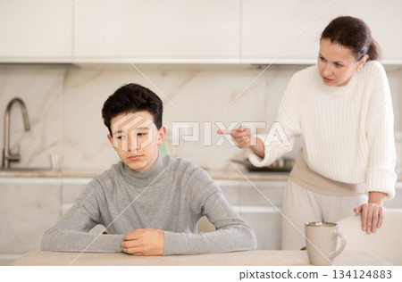 Mother and son arguing Mother and son arguing 134124883