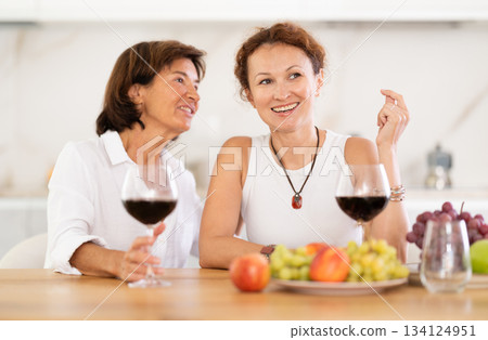 Party for girlfriends - women drinking wine and telling each other news 134124951