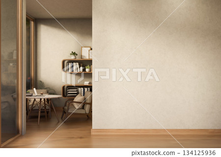Empty wall alongs wooden parquet floor corridor with table and chair aside bookshelf in corner room. 134125936