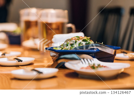 Banquet table with food lined up 134126467