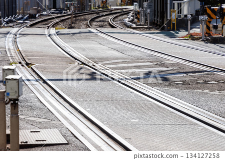 Wide railroad crossing, intersection of railroad tracks and road 134127258