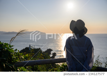 Twilight sea and woman 134127577