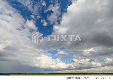 A vast open sky featuring dynamic cloud formations that evoke a sense of wonder and beauty 134127694