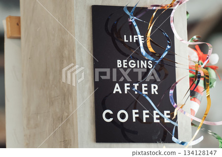 Life begins after coffee - A close-up of the slogan on a coffee shop sign - an element of the New Year's Christmas decoration of the coffee shop's interior. High quality photo. Life begins after coffee - A close-up of the slogan on a coffee shop sign - an element of the New Year's Christmas decoration of the coffee shop's interior. High quality photo. 134128147