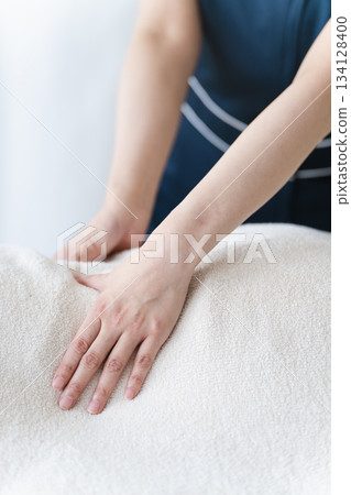 Young woman receiving massage from therapist Beauty image Young woman receiving massage from therapist Beauty image 134128400