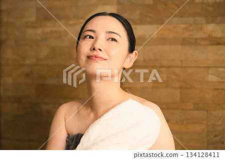 Young woman wiping sweat with a towel Beauty image 134128411