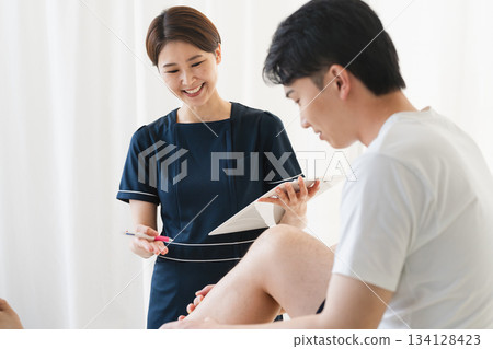 Therapist counseling a young man Therapist counseling a young man 134128423