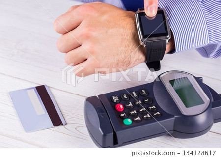 Man using smart watch to express pay 134128617