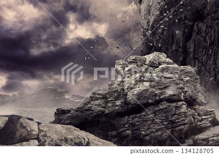 Rock crashing down from cliff 134128705