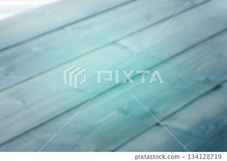Flat design is showing blurred wooden deck planks lying diagonally in turquoise gradient tones Flat design is showing blurred wooden deck planks lying diagonally in turquoise gradient tones 134128719
