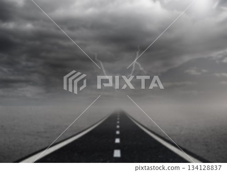 Empty road in sea against lightning Empty road in sea against lightning 134128837