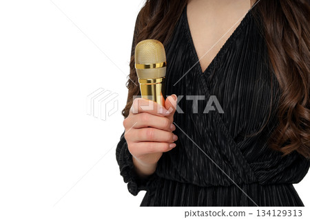 Woman in black dress holds a gold microphone, isolated, PNG Woman in black dress holds a gold microphone, isolated, PNG 134129313