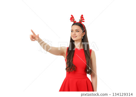 Woman in red dress with reindeer headband points, isolated, PNG Woman in red dress with reindeer headband points, isolated, PNG 134129314