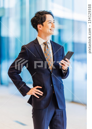 Businessmen using smartphones Businessmen using smartphones 134129388
