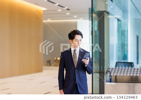 Businessmen using smartphones 134129463