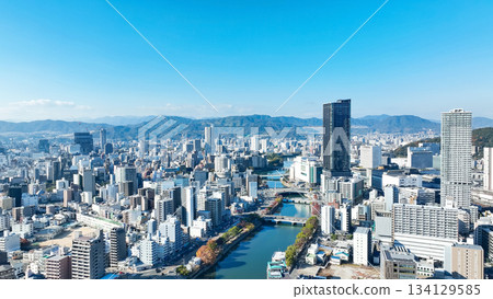 Drone aerial view of city and blue sky Drone aerial view of city and blue sky 134129585