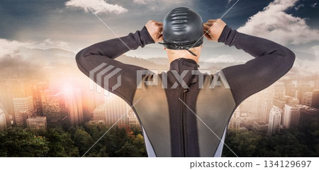 Rear view of swimmer against cityscape Rear view of swimmer against cityscape 134129697