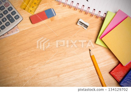 Flat design illustration is showing stationery items on wood desk, with calculator and rulers 134129702