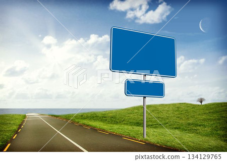 Flat design illustration is showing blank blue road sign on coastal road with leafless hilltop tree 134129765