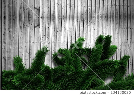 Fir branches on wooden planks 134130020
