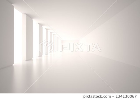White corridor is extending toward vanishing point, showing polished floor reflections from windows 134130067