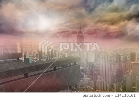 City skyline is unfolding beneath concrete railing in 3D render featuring spire-topped tower 134130161