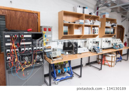 Flat design electronics lab is featuring equipment rack, test bench, oscilloscopes and cable reels 134130189