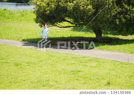 Young woman running sports image Young woman running sports image 134130366