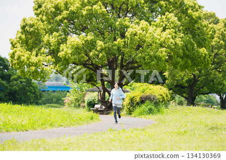 Young woman running sports image 134130369