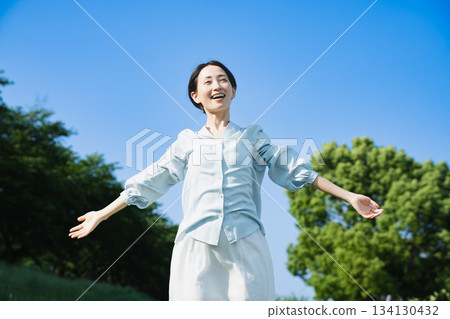 Young woman stretching outdoors Lifestyle image Young woman stretching outdoors Lifestyle image 134130432
