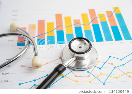 Stethoscope on chart or graph paper, Financial, account, statistics and business data medical health. Stethoscope on chart or graph paper, Financial, account, statistics and business data medical health. 134130449