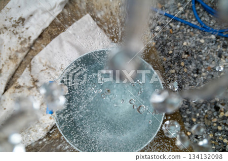 Hand washing in a bucket Hand washing in a bucket 134132098