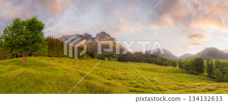 Meadow with road and bench during sunset in Berchtesgaden National Park 134132633
