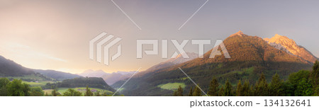 Meadow with road and bench during sunset in Berchtesgaden National Park Meadow with road and bench during sunset in Berchtesgaden National Park 134132641