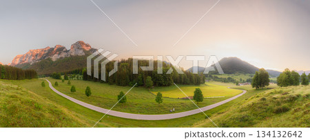 Meadow with road and bench during sunset in Berchtesgaden National Park Meadow with road and bench during sunset in Berchtesgaden National Park 134132642