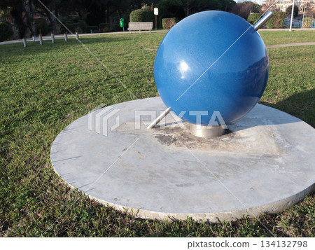 Parallel map, model of earth in park for studying seasonality and other natural changes. Education and science, astronomy. 134132798