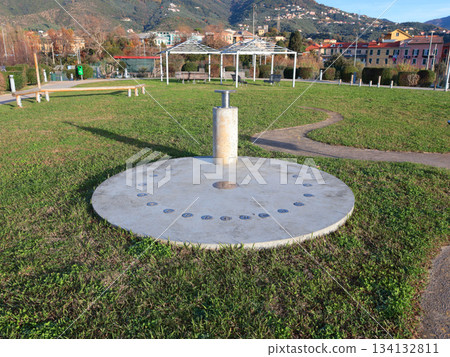 Sundial in park early in morning. Educational and models for astronomy.  134132811