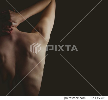 Woman is stretching back in flat design scene with soft lighting, dark negative space, copy space Woman is stretching back in flat design scene with soft lighting, dark negative space, copy space 134135303