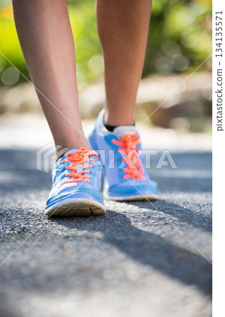 Low section of woman jogging Low section of woman jogging 134135571