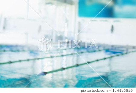 Central lap pool is reflecting natural light in flat design, featuring green white lane ropes Central lap pool is reflecting natural light in flat design, featuring green white lane ropes 134135836