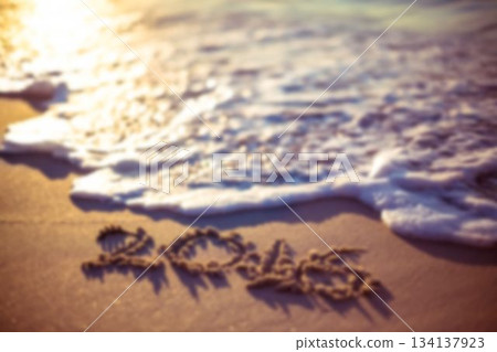 Love text on sand at beach 134137923