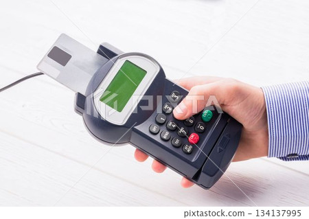 Man paying with credit card 134137995