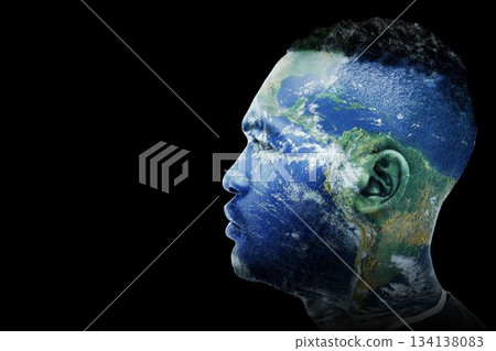 Male head silhouette is featuring digital composite Earth satellite texture on black void backdrop Male head silhouette is featuring digital composite Earth satellite texture on black void backdrop 134138083