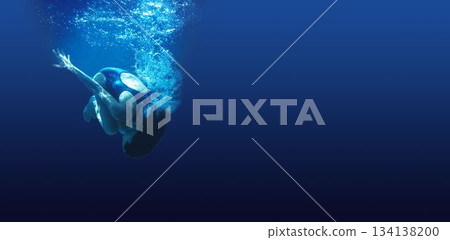 Man swimming in blue water Man swimming in blue water 134138200