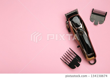 Hair clipper on pink background. Modern hair clipper. 134138674