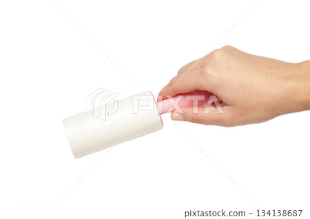 Woman holding lint roller isolated on white background. Top view Woman holding lint roller isolated on white background. Top view 134138687