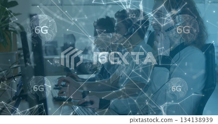 Collaborating IT specialists typing and speaking into headsets at workstations with 6G overlay Collaborating IT specialists typing and speaking into headsets at workstations with 6G overlay 134138939