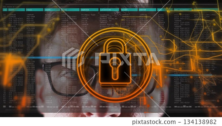 Mid adult man wearing eyeglasses analyzing code streams in workspace with padlock icon 134138982