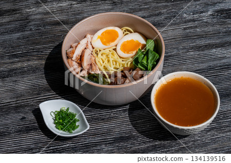 Ramen soup in a cafe. Broth separately. Ramen soup in a cafe. Broth separately. 134139516